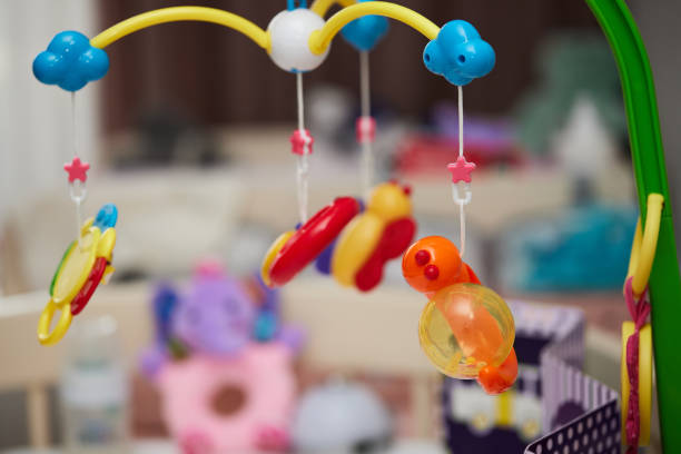 Carousel of children's soft colored toys.