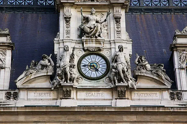 Architectural details with sculptures and clock - Hotel de Ville, Paris