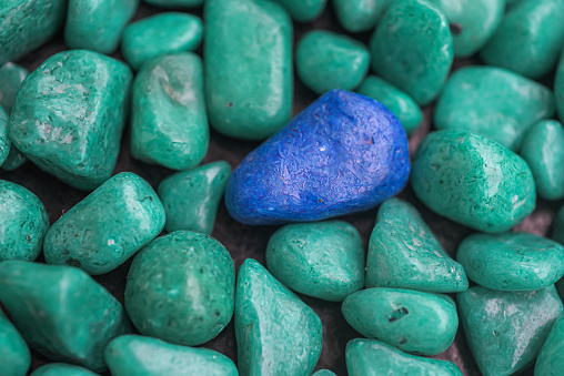 A variety of coloured pebbles piled together, nice background for phones and desktop computer wallpapers.