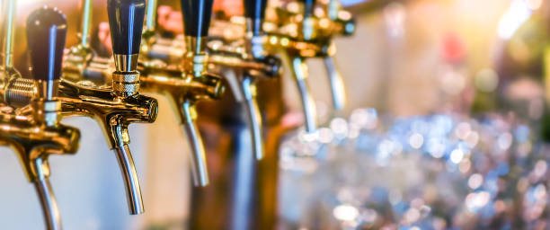 istock Beer tap selective focus wide banner. 1404662075