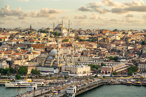 Istanbul skyline at sunset, Turkey. Panoramic view of Galata bridge, Golden Horn and old district Fatih