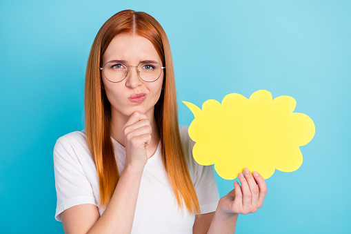 Photo of young girl hand touch chin think creative dilemma creative cloud isolated over blue color background.