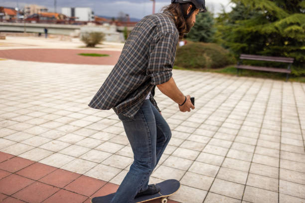 istock Young Caucasian man riding skateboard at the public park 1404664146