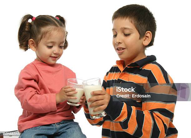 Brother And Sister Drinking Milk Stock Photo - Download Image Now - Boys, Celebratory Toast, Child