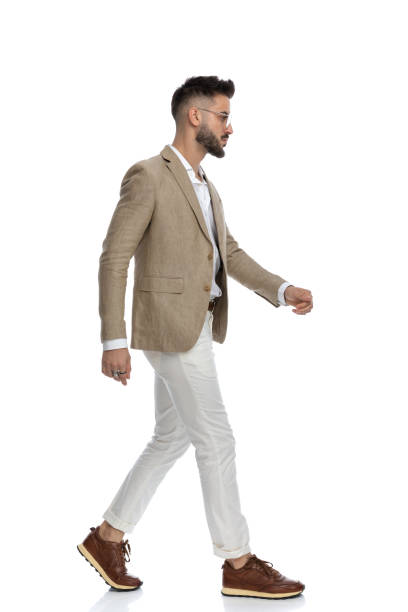 istock side view of a handsome businessman walking with attitude 1404665742