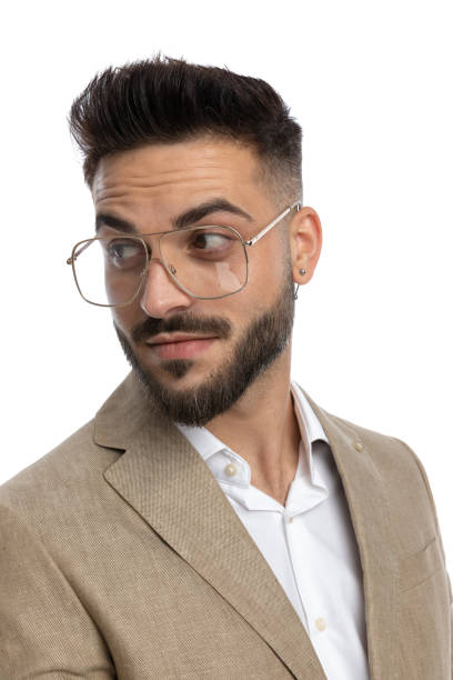 istock businessman looking back over shoulder with a subtle smile 1404666411