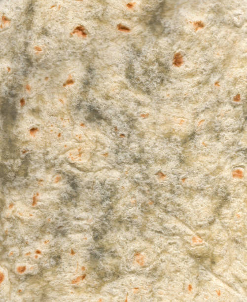 istock Closeup shot of fresh bright texture flatbread 1404667159