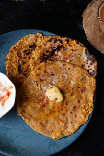 istock Paneer Paratha with curd and tea 1404667245
