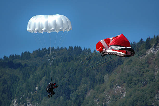 parachutist 1 falling parachutist trying to open his auxiliary parachute para ascending stock pictures, royalty-free photos & images