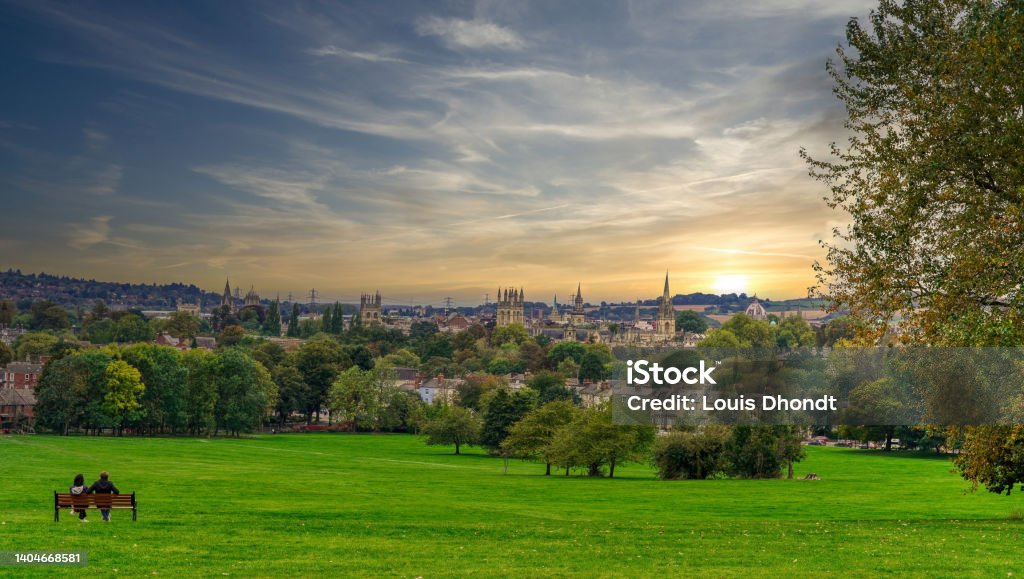 The skyline of Oxford, UK This photograph was taken from the top of 'South Park' in Oxford, capturing the sunset of the city's skyline. The original sky in this image has been replaced with software. Oxford - England Stock Photo