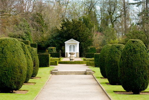 A small summer house within the grounds of a mansion