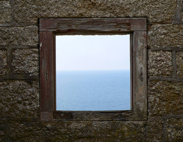 This image was taken on Lundy island, which is a small island off the coast of North Devon. Down a stairway which led you nearer to sea level was a ruined hut with a window to the sea.