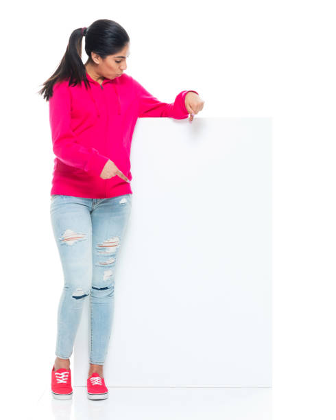 istock Generation z female in front of white background wearing jeans 1404670106