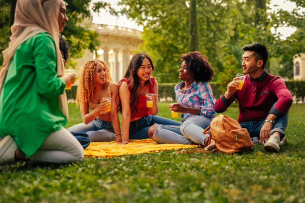 istock Young people gathering in park 1404670440
