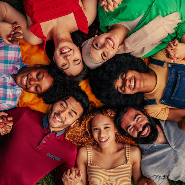 istock Diverse group of friends lying in circle 1404670478