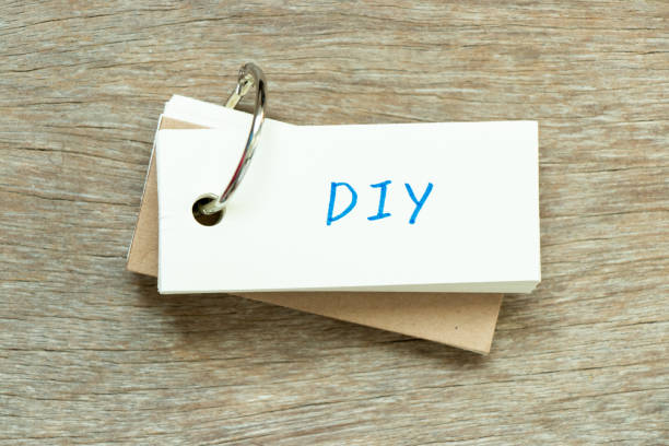 istock Flash card with handwriting word DIY (abbreviation of do it yourself) on wood background 1404672218