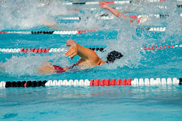 istock Competitive swim meet with swimmers 140467223