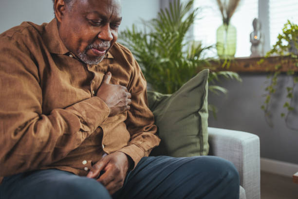 istock Unhappy mature male having heart attack 1404672491