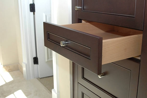 istock An open drawer on a dark brown dresser 140467258
