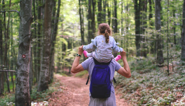 istock Father and his daughter in the nature 1404674899
