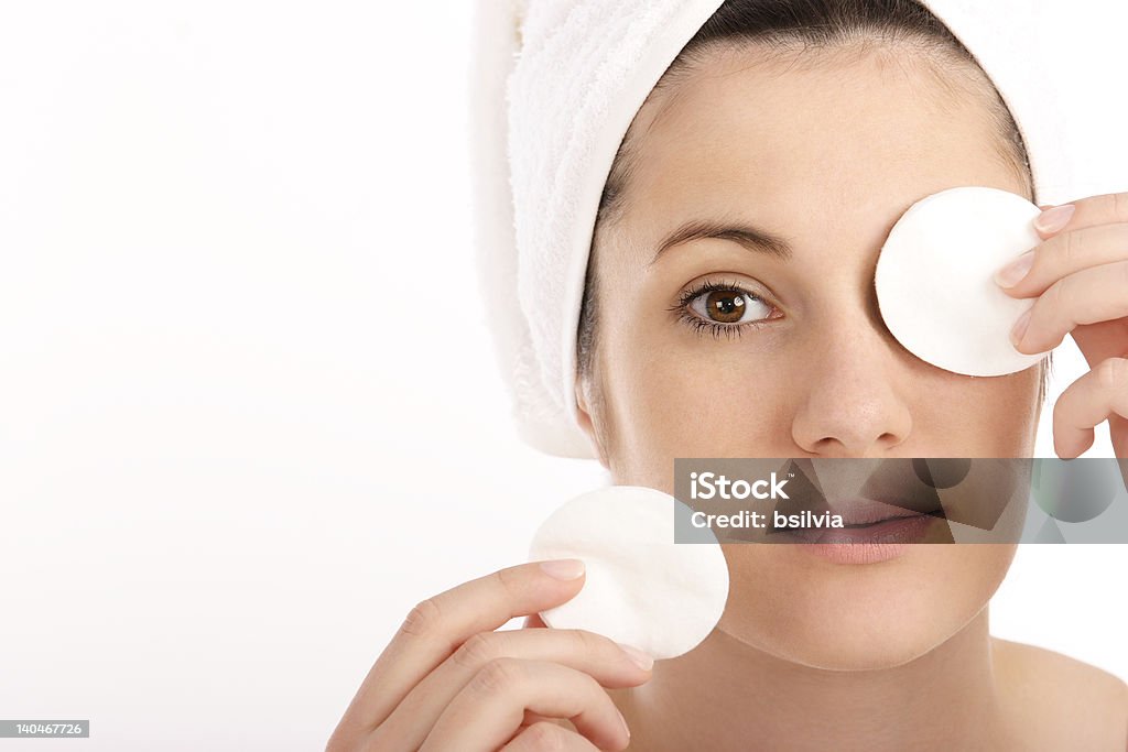 Cosmetic pads Young woman cleaning her face with cosmetic pads Adult Stock Photo