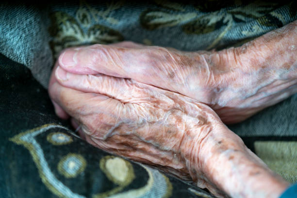 istock Hands of an old woman folded one by other. 1404679369