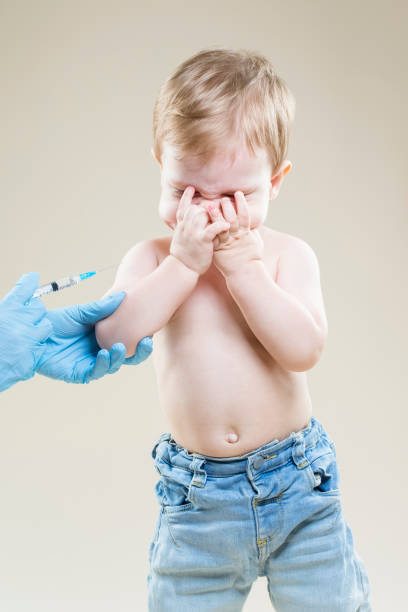 istock Medical Ideas and Concepts. One Little Caucasian Boy Is Beeing Vaccinated with Protective Vaccine. 1404679388