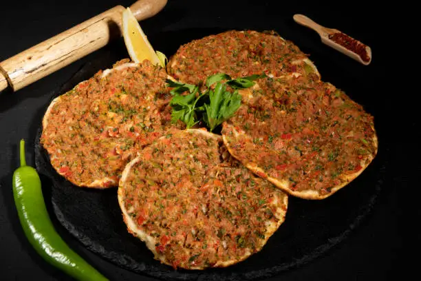 Traditional Turkish pide with minced beef. Meaty Pita, thin piece of dough topped with minced meat. cooked in stone furnace.