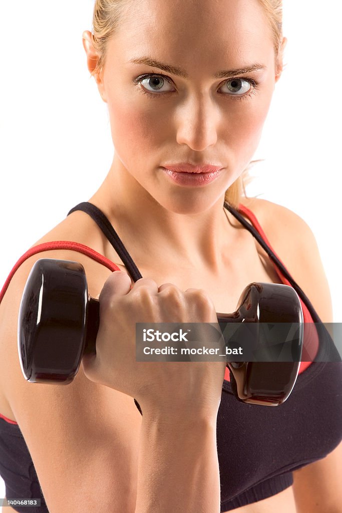 Dumbbell black dumbbell in hand of working out blonde female Active Lifestyle Stock Photo