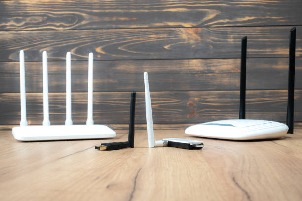 istock Different types of Wi-Fi routers, modern and old technology. Wireless ethernet connection signal. USB Wifi Receiver Wireless Network Card. High Speed Antenna Wifi Adapters. 1404682291