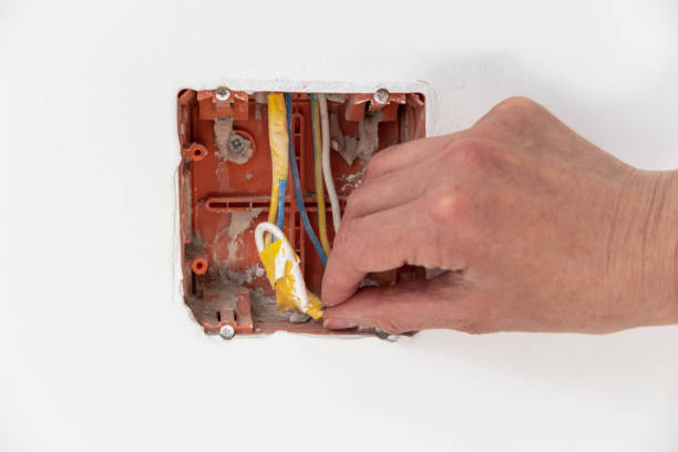 istock New electrical installation, holes for sockets and electrical cables on the wall. repair concept. 1404683541