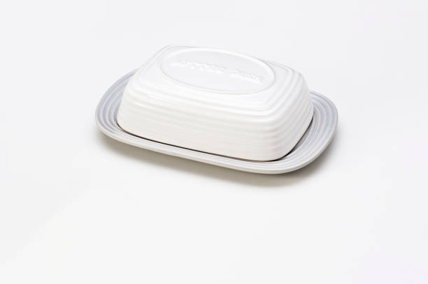 White ceramic butter dish with lid, isolated on white
