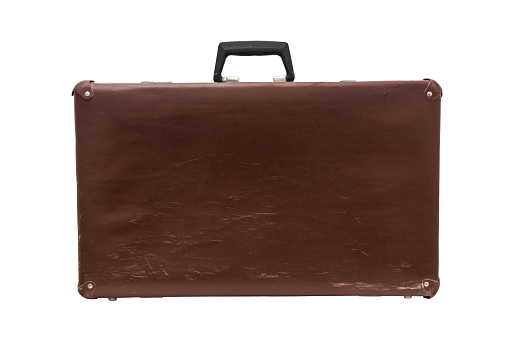 Old leather vintage suitcase isolated on white