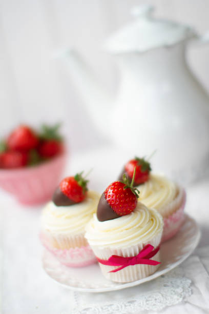 istock Strawberries and cream cupcakes for an afternoon tea 1404686097