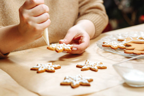 istock Ginger cookies in the hands decorated with icing 1404691951