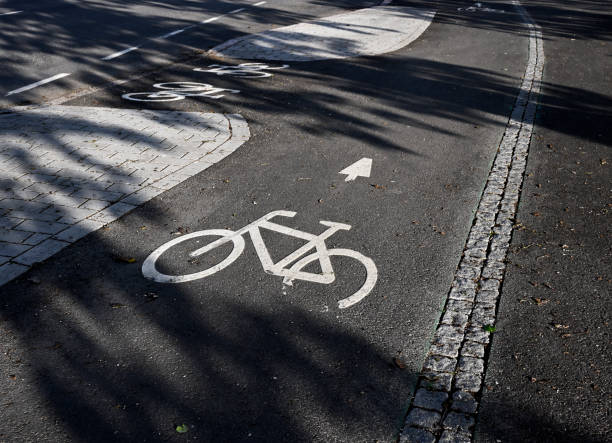 istock bike path signs on the asphalt 1404692138