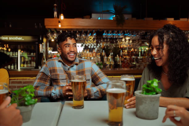 istock diverse group of friends out for drinks in restaurant 1404692871