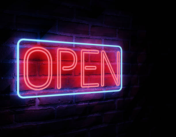 istock Neon open sign on brick wall background. Bright blue red lamp electric illuminated decoration, 3D illustration 1404694060