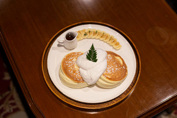 istock souffle pancake dessert with cream served on a white plate 1404696718