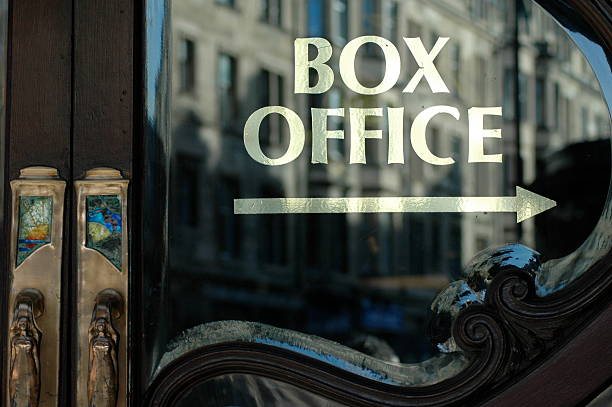 Box Office this way Early morning sun reflected on box office window box office photos stock pictures, royalty-free photos & images