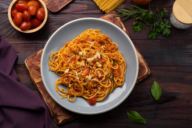 istock Spaghetti with minced pork in tomato sauce, pasta with a meat based bolognese tomatoes 1404696839