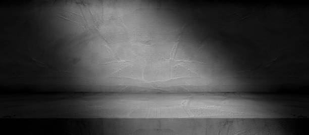 istock dark black decorative cement wall room background with light and shadow abstract wallpaper background 1404697004