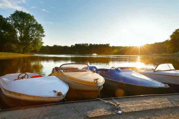 Old pedal boats from the 50s at a lake in Cologne