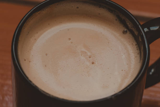 istock closeup coffee  latte cup on a wooden floor 1404697246