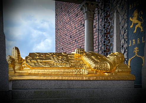 golden monument for Birger Jarl situated on a public place at the base of the tower of the Stadshuset in Stockholm, Sweden.  It was made by Ragnar Östbergs and Gustaf Sandberg in the twenties of the twentieth century.