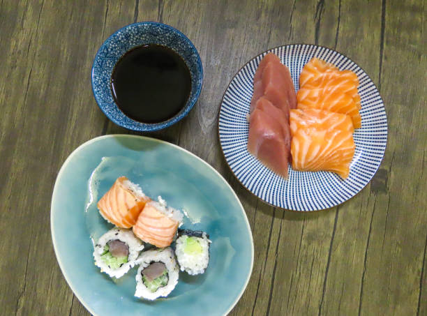 Sushi rolls with sashimi and soy sauce