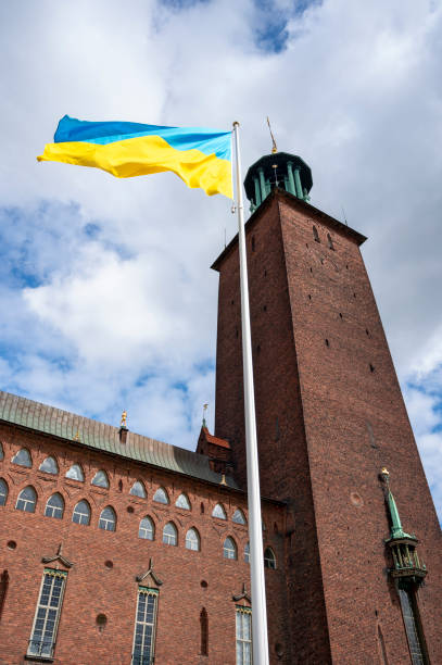 ukrainian flag before Stadshuset in Stockholm ukrainian flag on the pole in front of the tower of the Stadshuset in Stockholm, Sweden kungsholmen town hall photos stock pictures, royalty-free photos & images