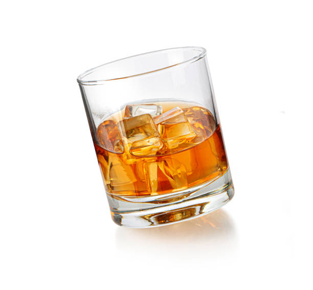 istock whiskey glass with ice on white 1404699770
