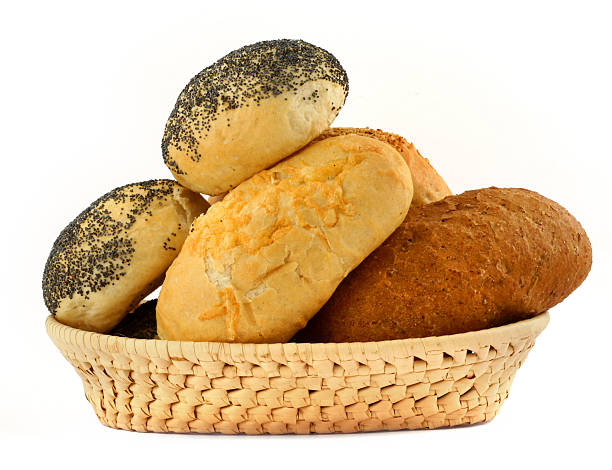 bakery basket basket full of bakery isolated on white background, see more my related images in: bread bun corn bread basket stock pictures, royalty-free photos & images
