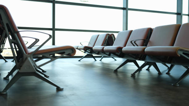 istock Empty brown leather chairs in airport lounge 1404701757
